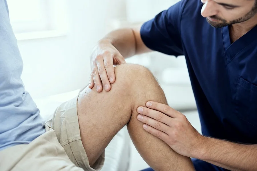 Knee Pain examination by a consultant